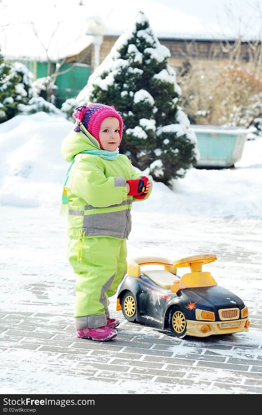 Happy girl in  winter  parka playing