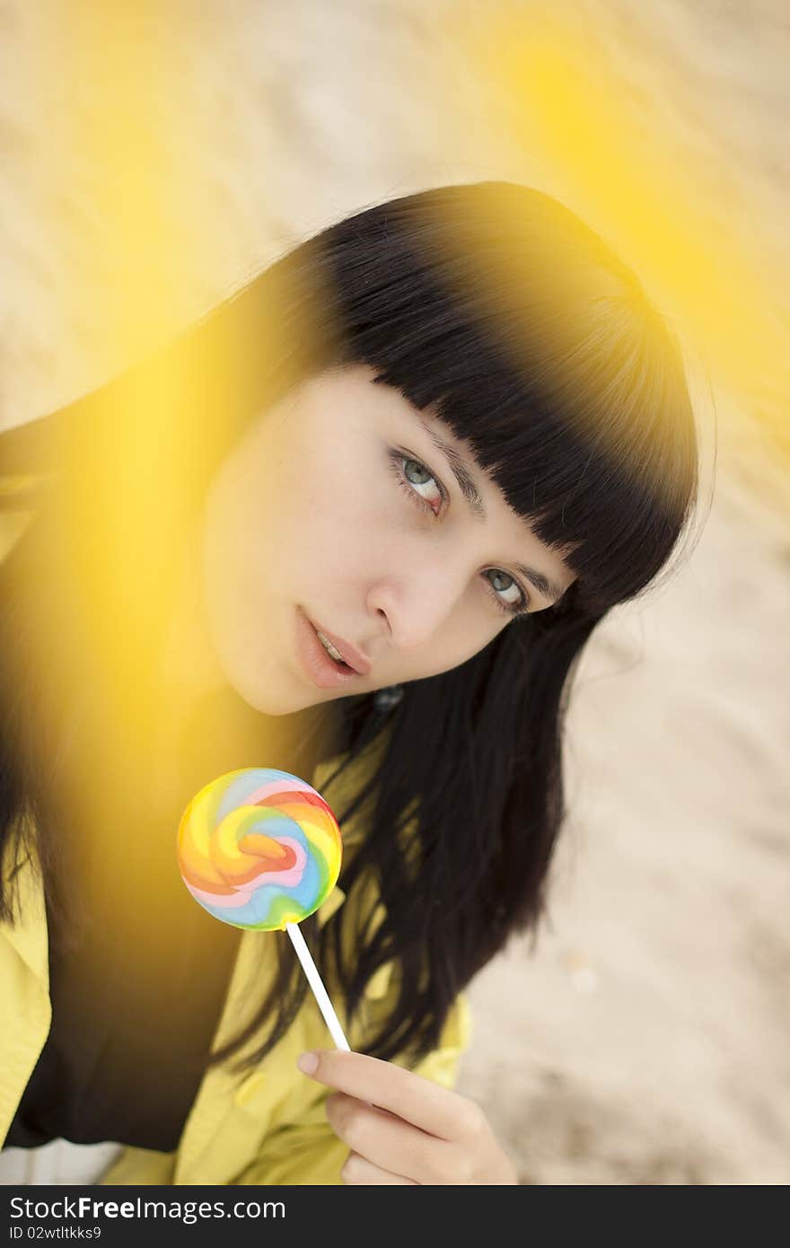 Woman eating candy lollipops