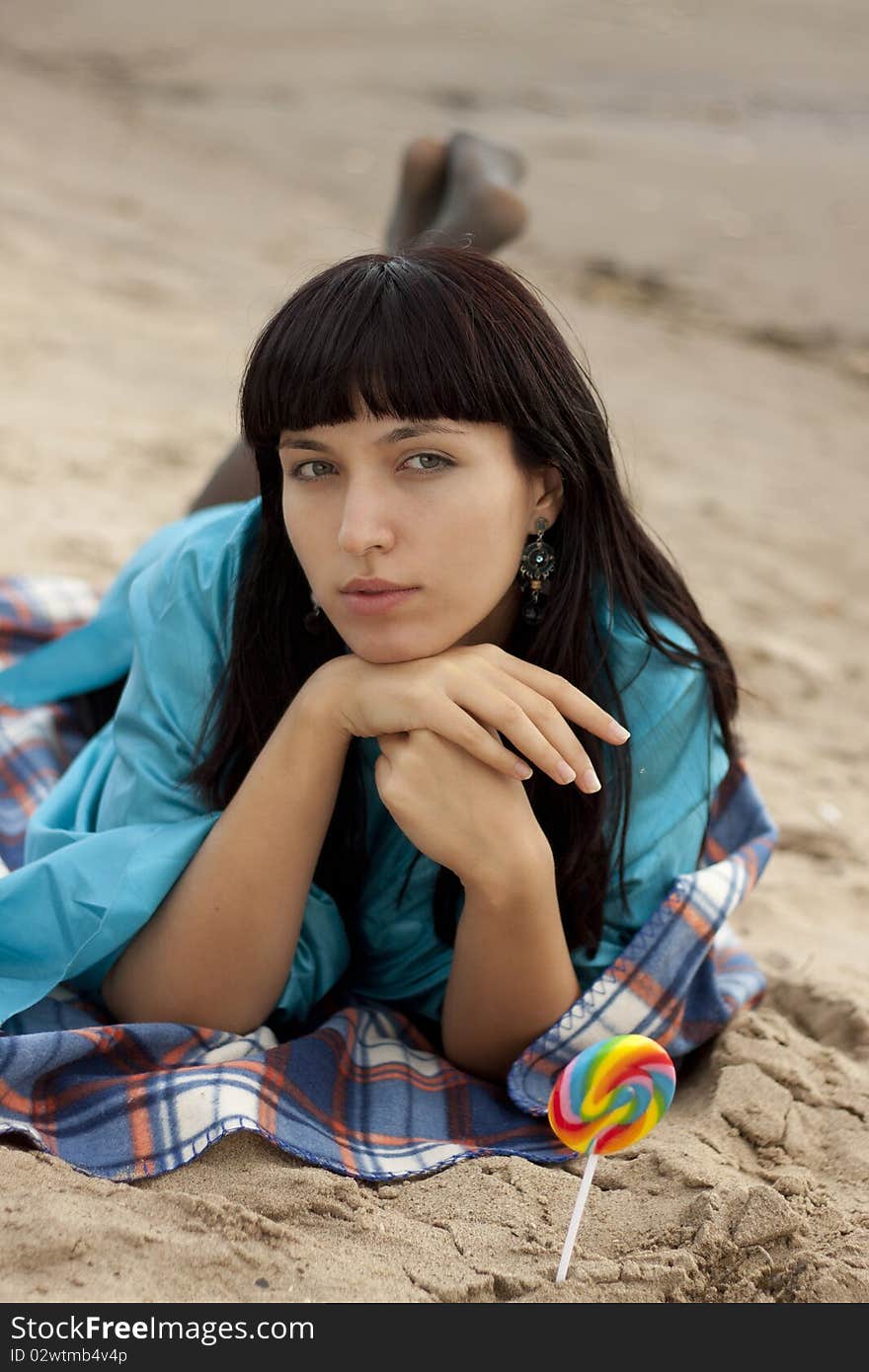 Woman eating candy lollipops