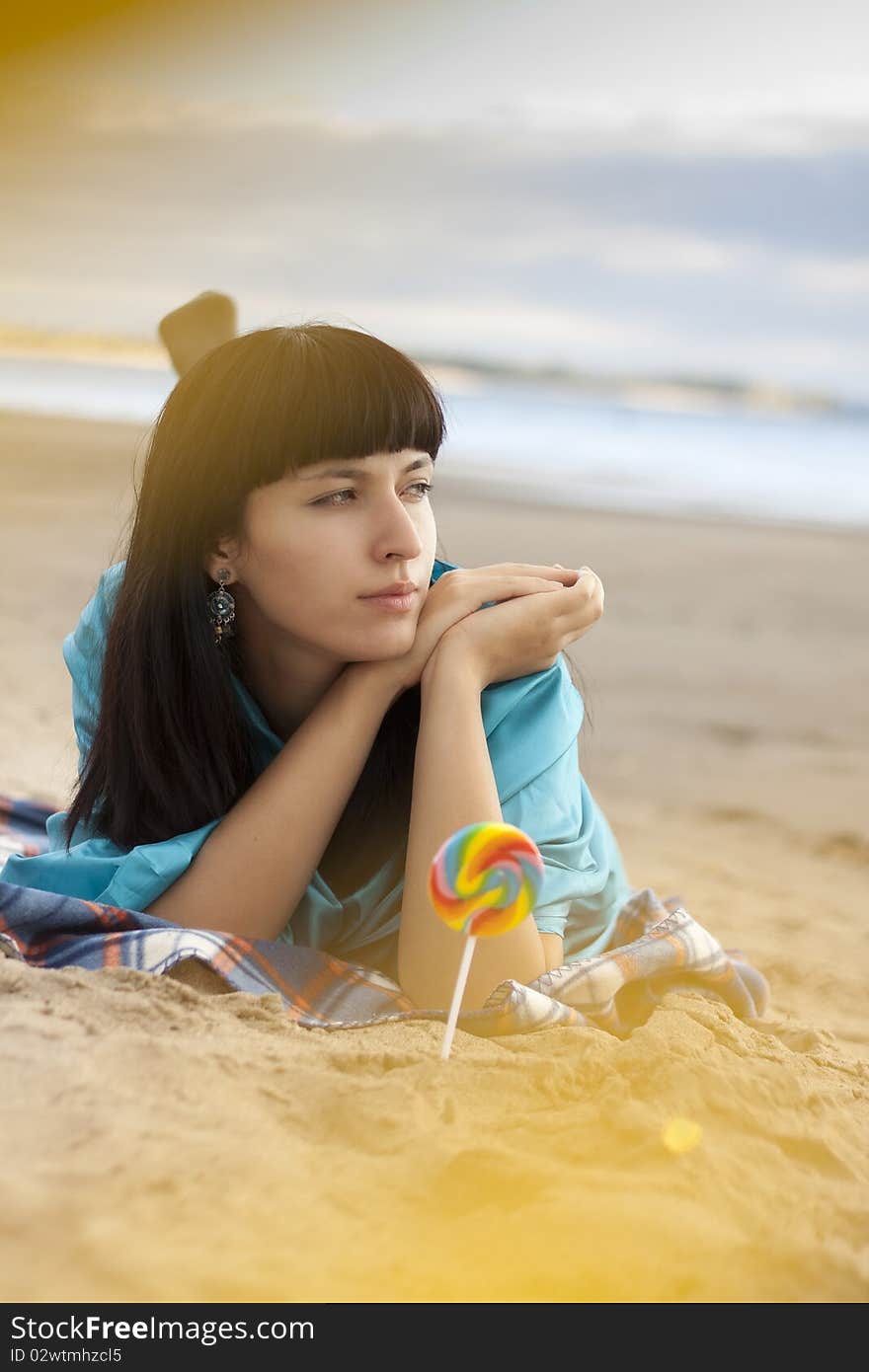 Woman eating candy lollipops