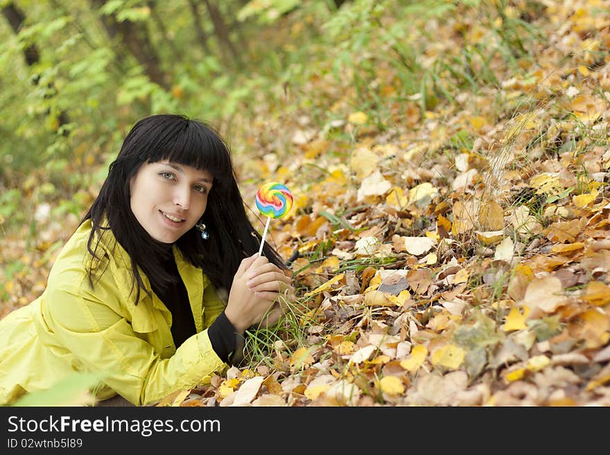 Portrait of a beautiful young woman in the autumn park. Portrait of a beautiful young woman in the autumn park