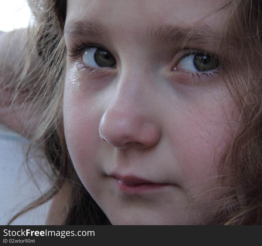 Portrait of cute small girl crying