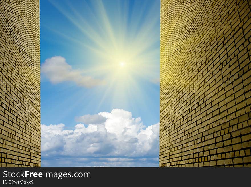 Yellow brick wall against the sky