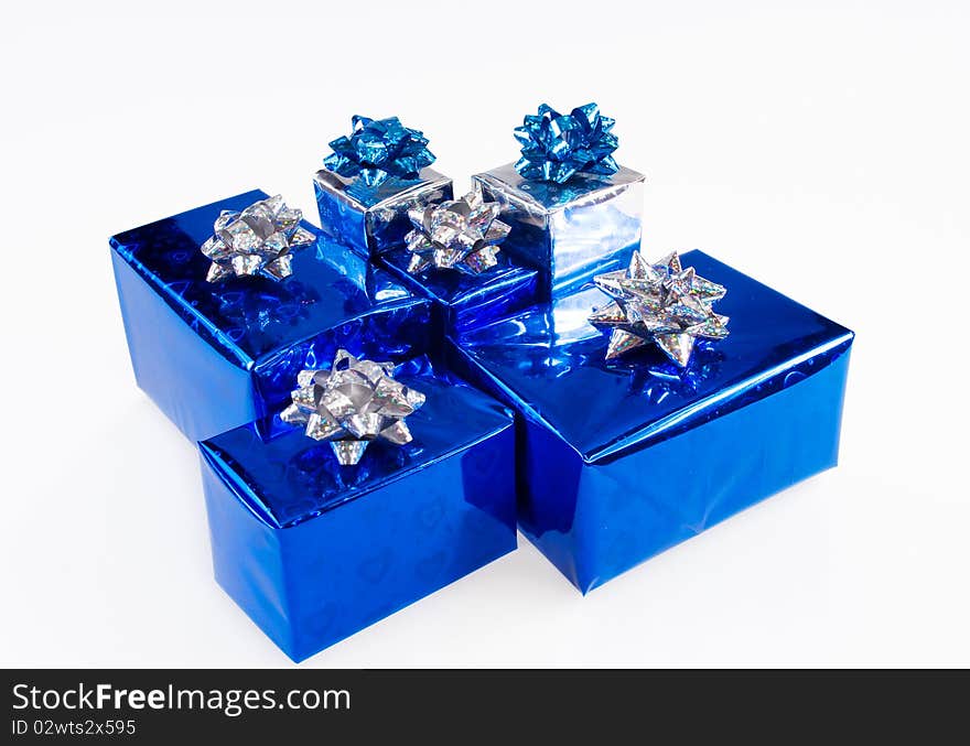 Blue shiny boxes for gifts with ribbons