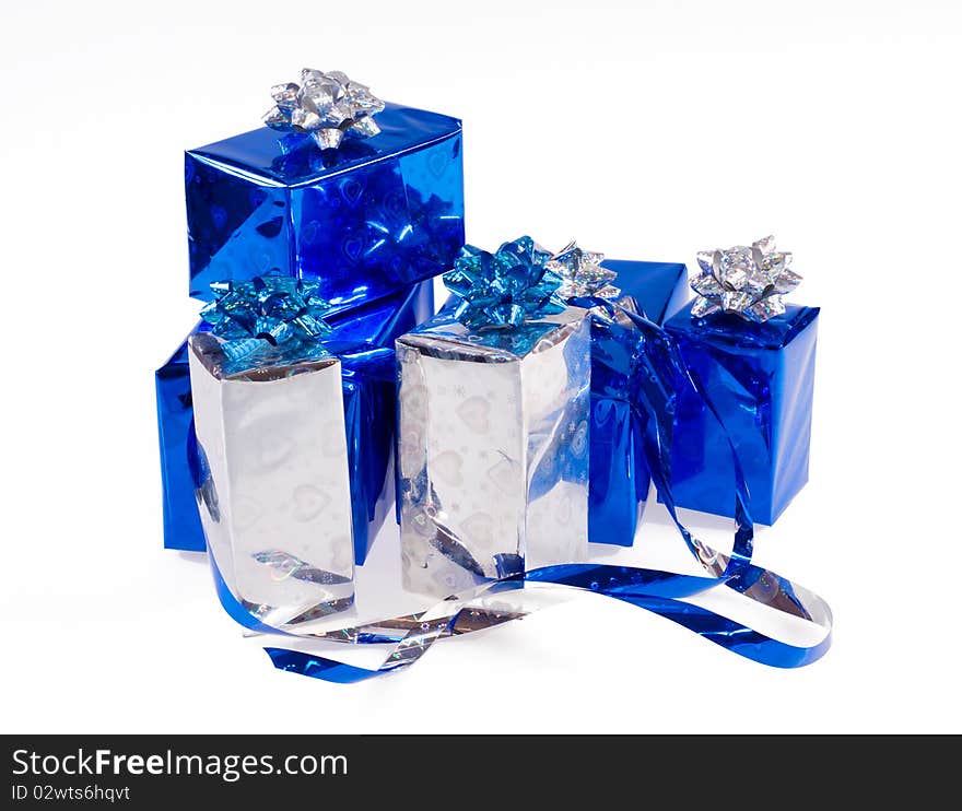 Many blue shiny boxes for gifts with ribbons