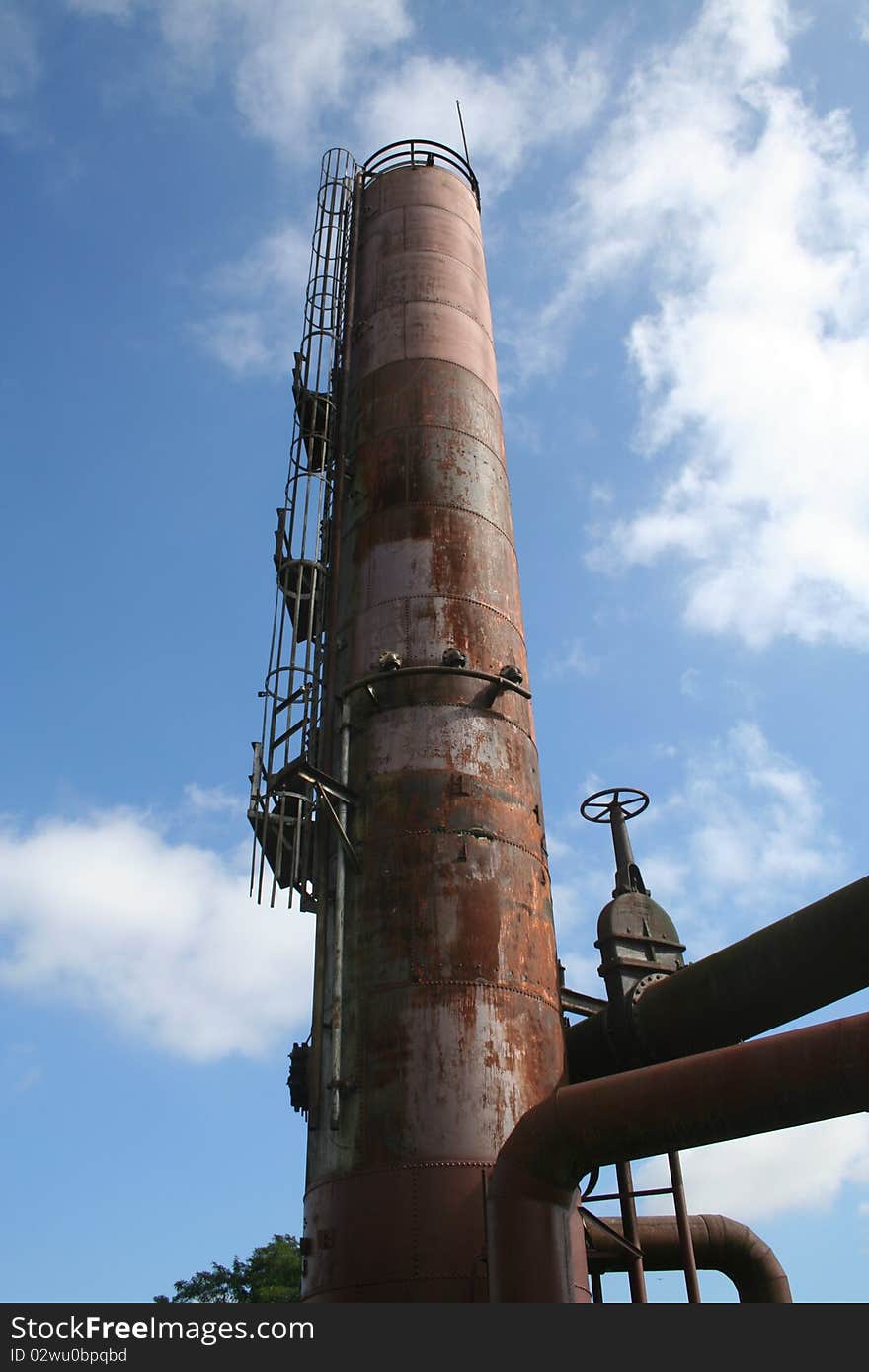 Rusty old gasworks tank with pipes at Seattle Washington Gasworks Park. Rusty old gasworks tank with pipes at Seattle Washington Gasworks Park.