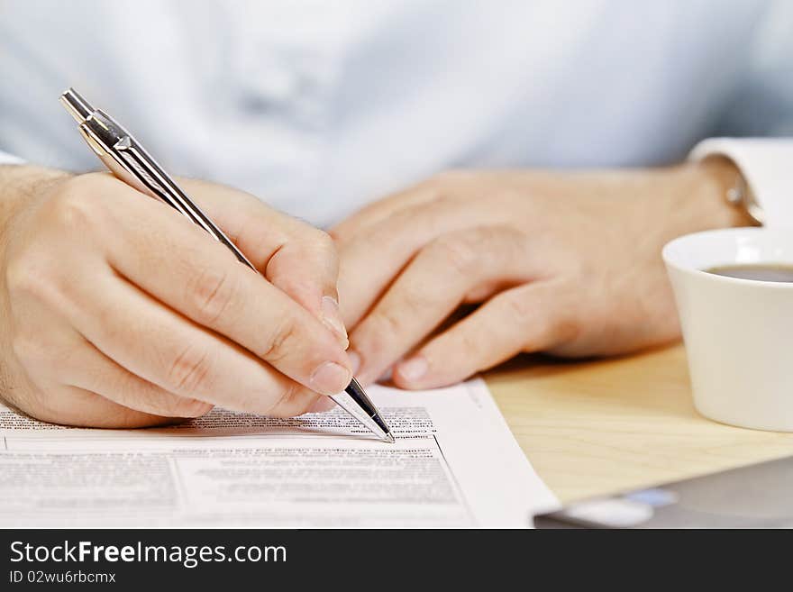 Close up of a hand holding a pen. Close up of a hand holding a pen