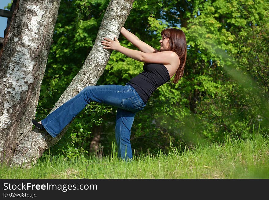 Beauty tomboy trying to get up the tree. Beauty tomboy trying to get up the tree.