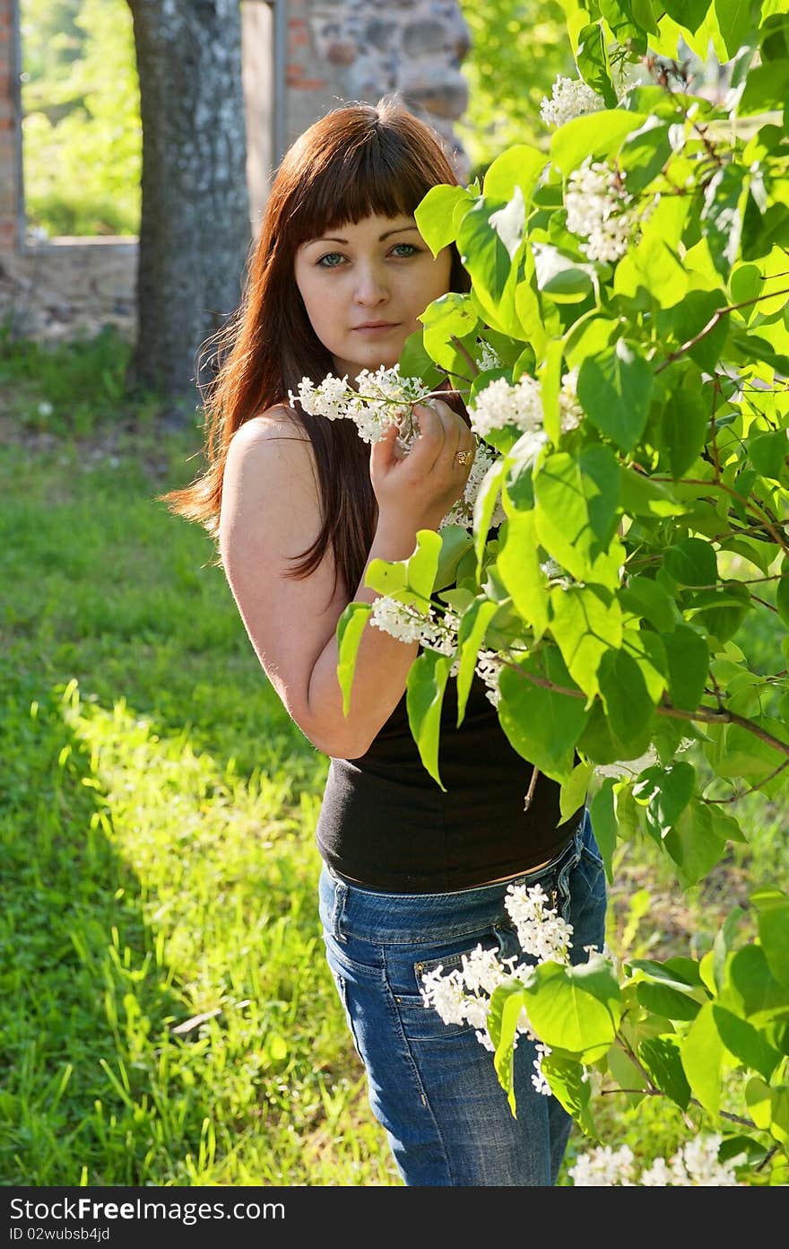 Young beautiful woman stand at pipe-tree with ruins on the background. Young beautiful woman stand at pipe-tree with ruins on the background.