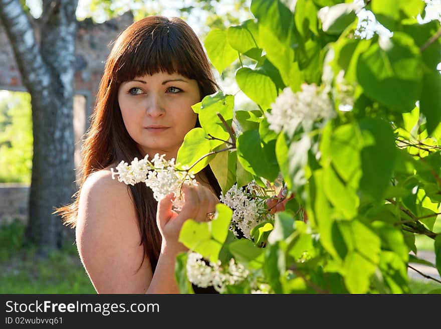 Portrait of young beautiful woman with pipe-tree. Portrait of young beautiful woman with pipe-tree.