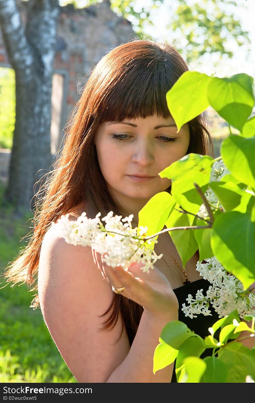 Portrait of young beautiful woman with pipe-tree. Portrait of young beautiful woman with pipe-tree.