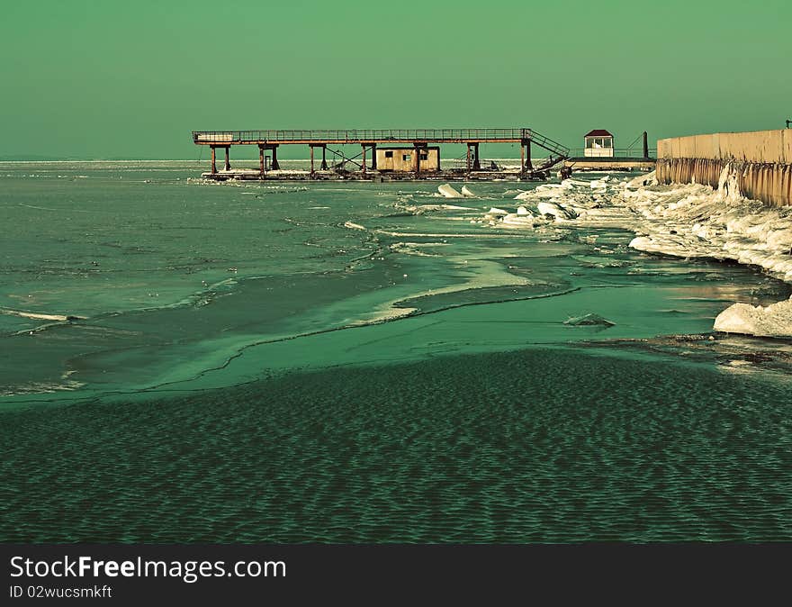 The bridge on the sea in the spring, thaws ice and snow. The bridge on the sea in the spring, thaws ice and snow