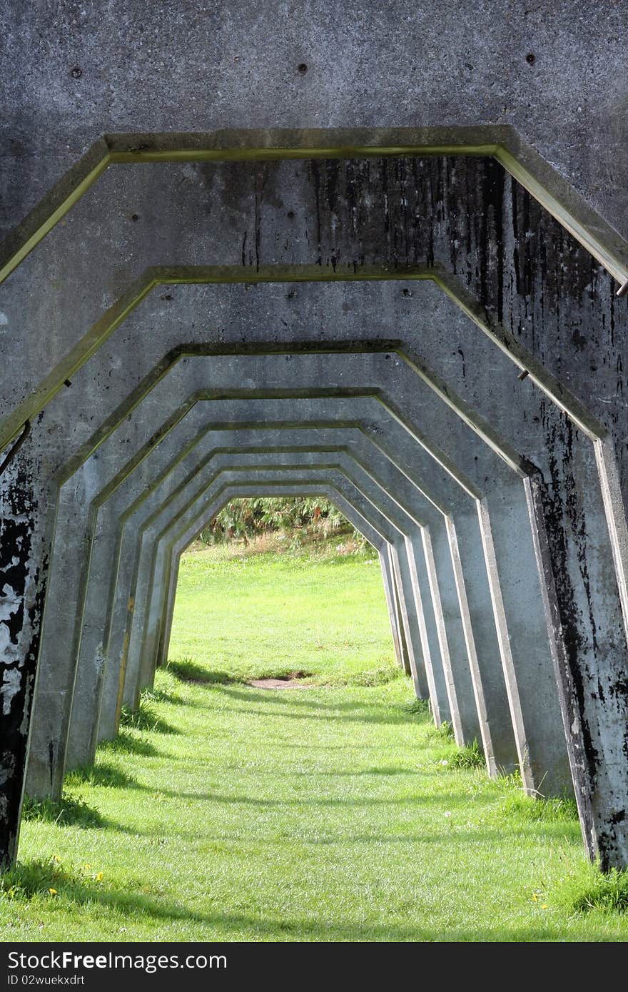 A set of concrete arches left over from early 20th century industry at Seattle Washington Gas Works Park.