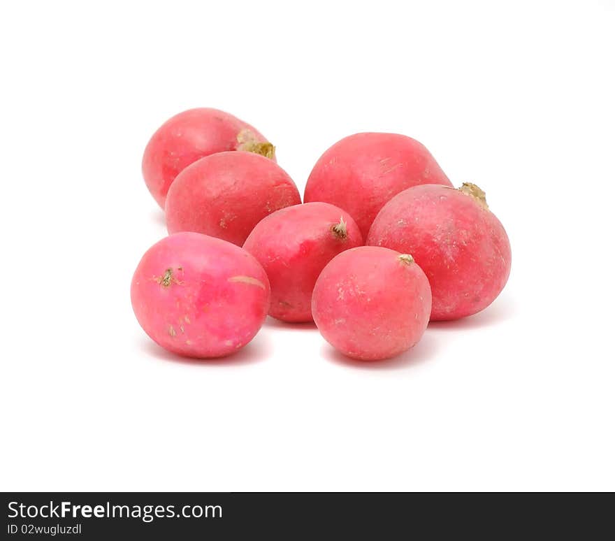 A pile of garden radishes isolated on a white background