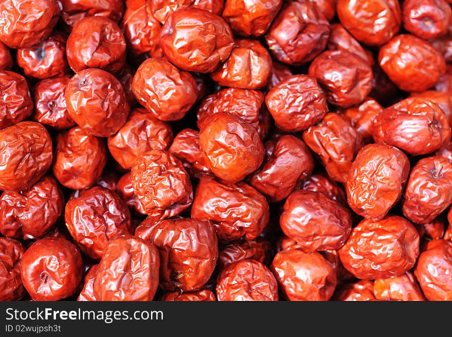 A pile of red Chinese date(or jujube) in autumn. A pile of red Chinese date(or jujube) in autumn.