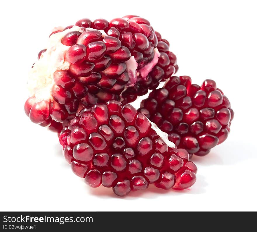 Pomegranate seeds on a white background