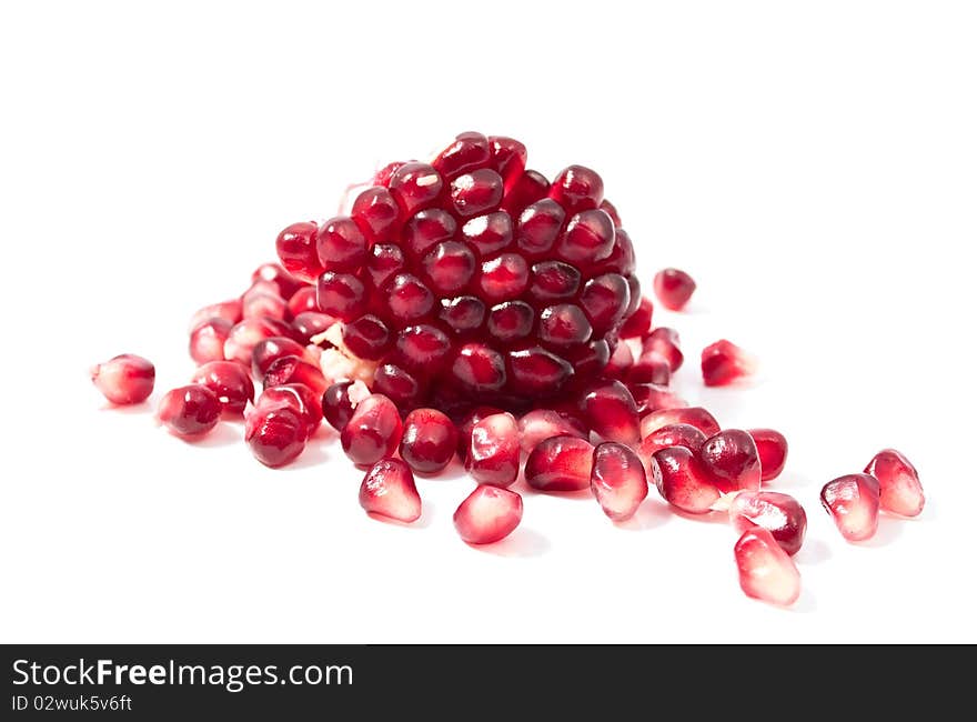 Pomegranate seeds on a white background