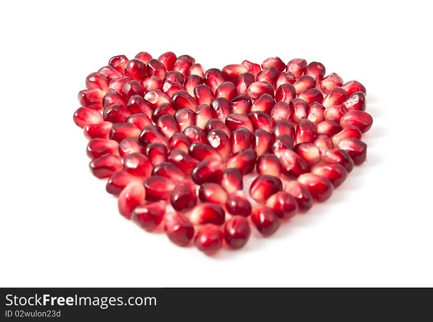 Valentine's heart shape made by pomegranate seeds