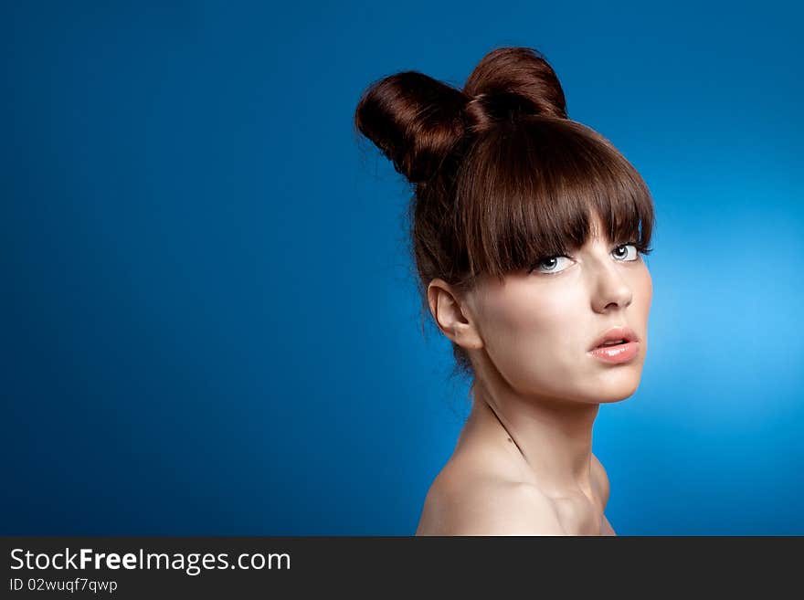 Beauty young girl on the blue background