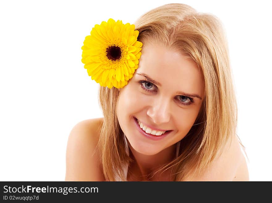 Attractive smiling woman portrait with flower on head, on white background