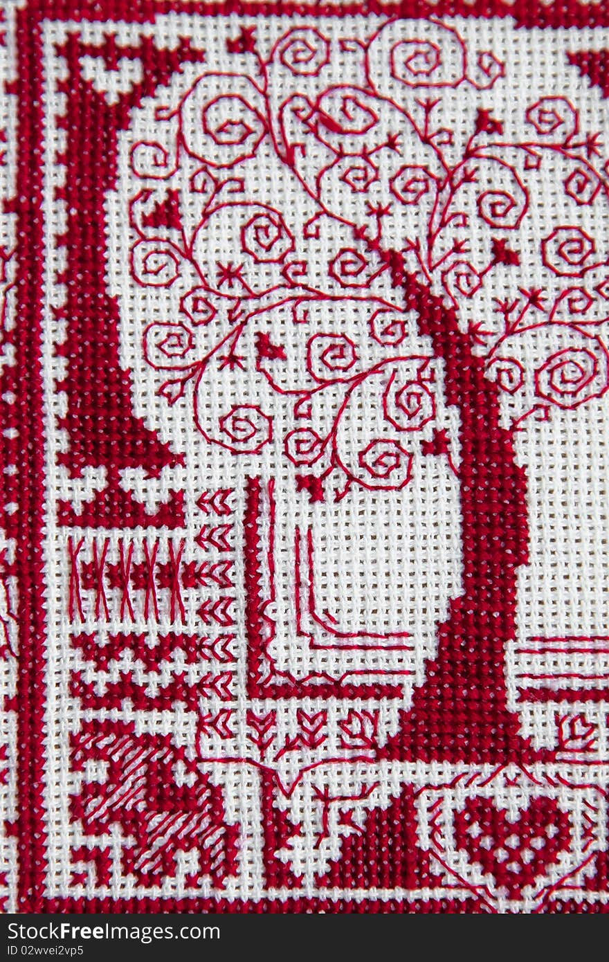 The embroidered traditional Russian talisman of a love tree. The embroidered traditional Russian talisman of a love tree