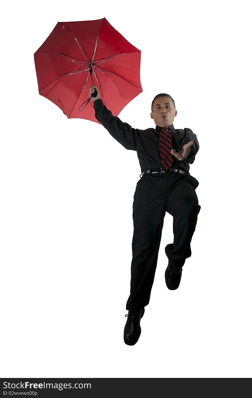 A guy flying with a red umbrella. A guy flying with a red umbrella