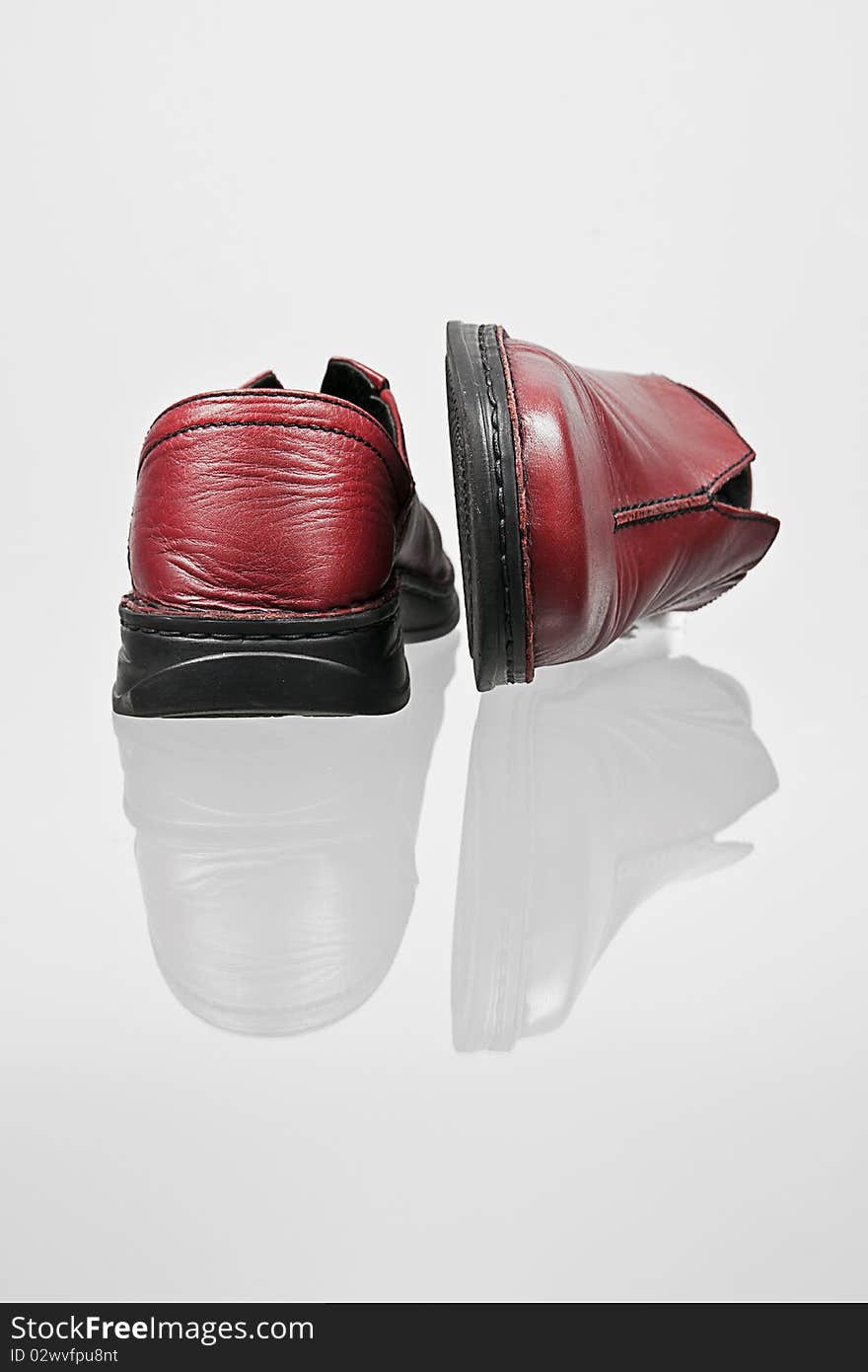 A red leather shoes reflexion. A red leather shoes reflexion