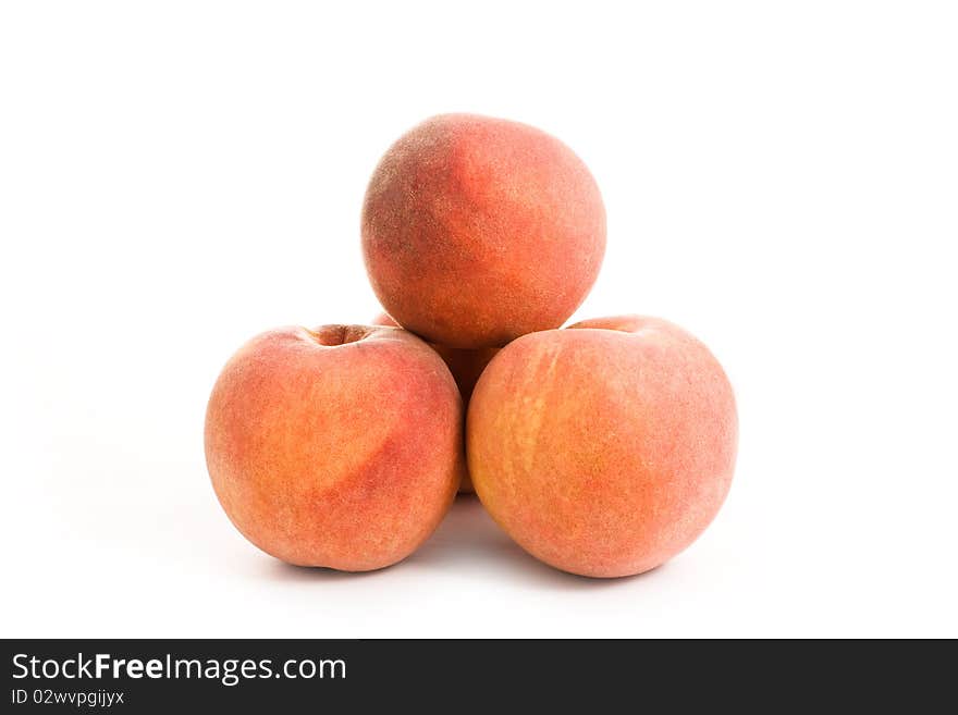 Close up shot of peaches isolated on white