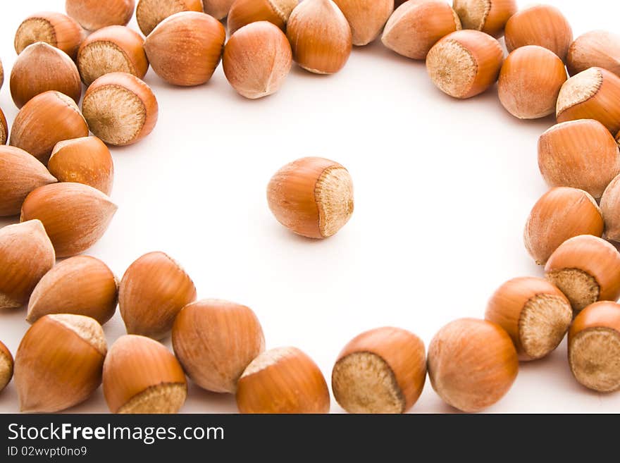 Brown haselnuts isolated on white