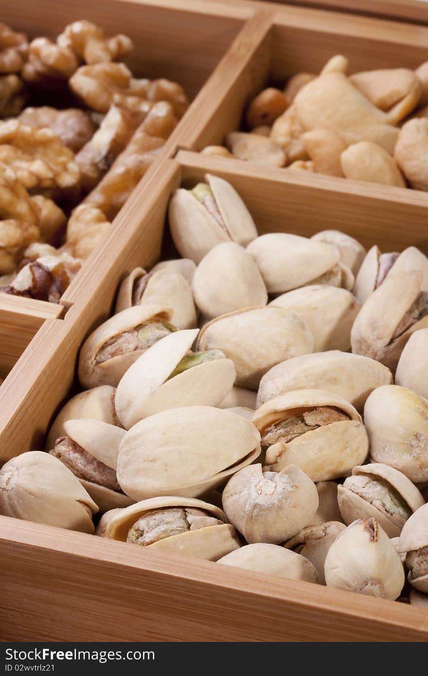 Nuts of different grades in a wooden box.