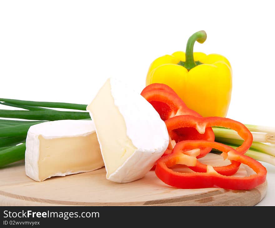 Wheel of French cheese with vegetables