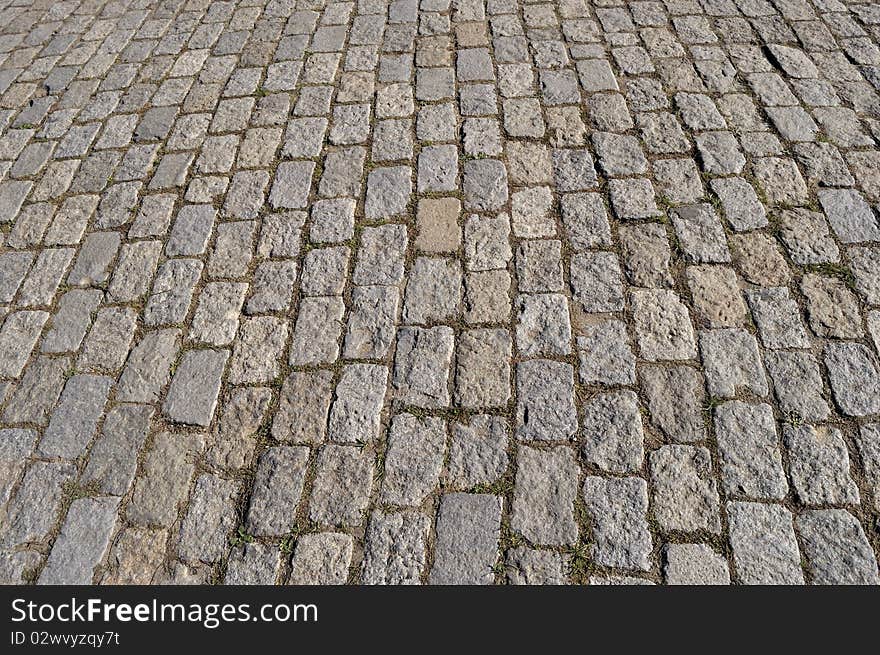 Fragment of old stone block pavement surface. Fragment of old stone block pavement surface