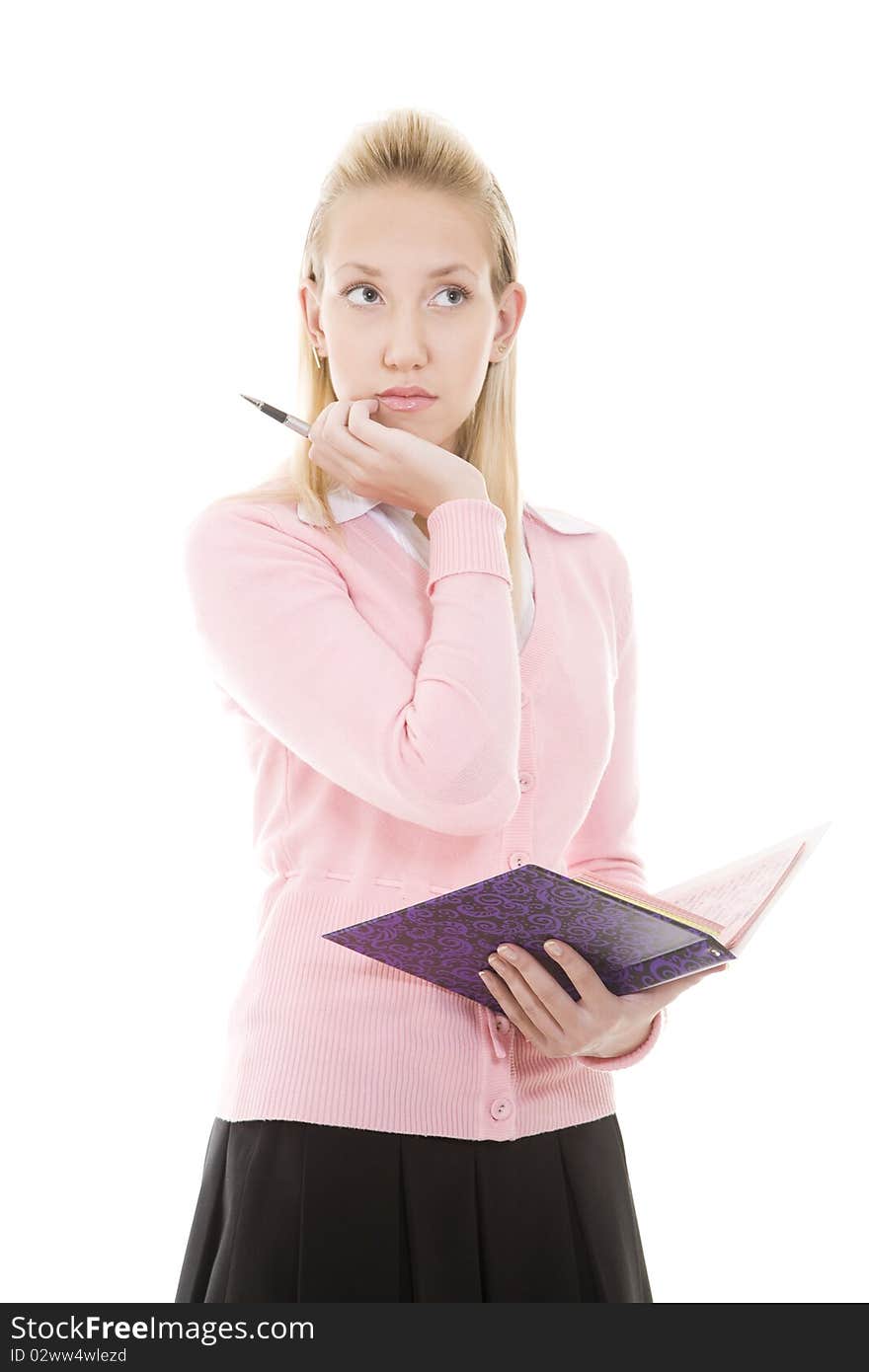 Pensive blonde girl with pen and diary/copybook