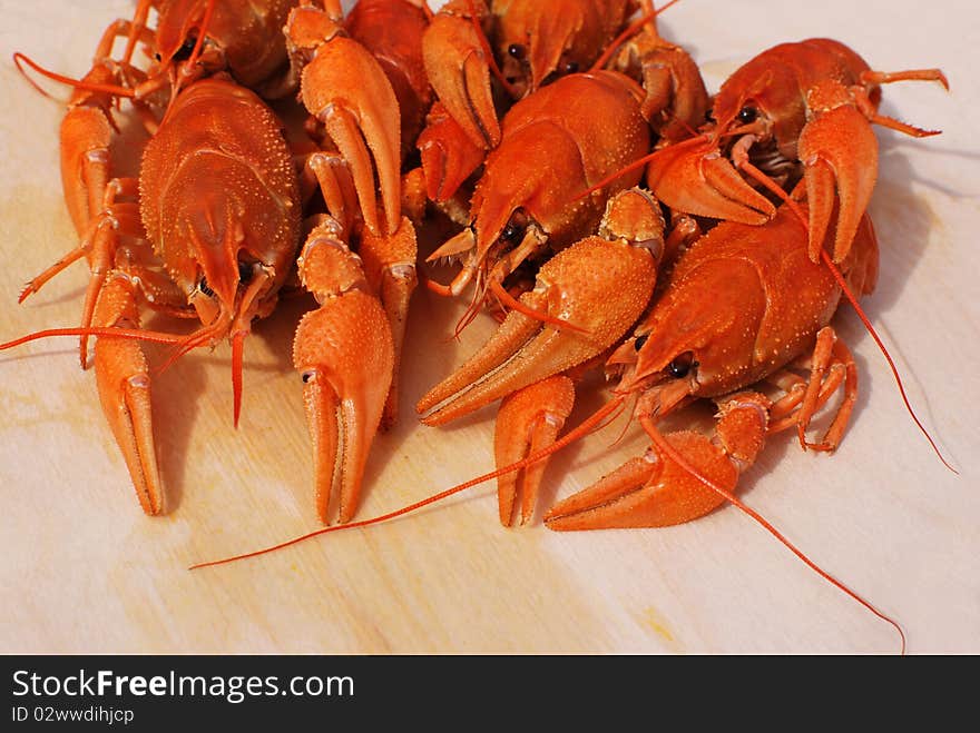 Boiled red crayfishes on table. Boiled red crayfishes on table