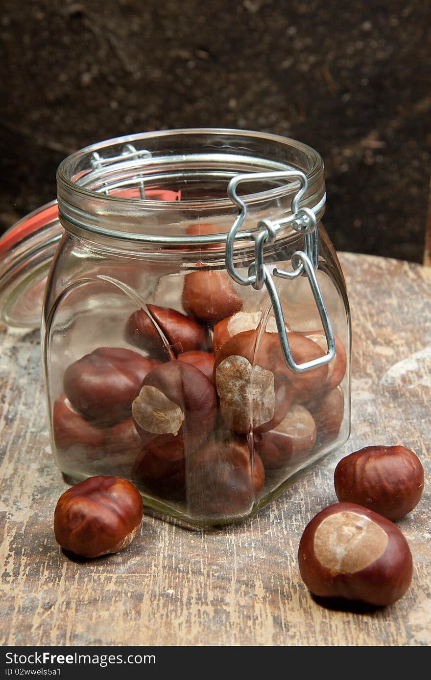 Chestnuts in the pot on the old wood