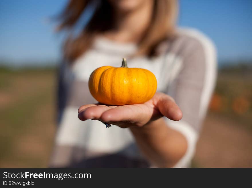 Holding A Pumpkin