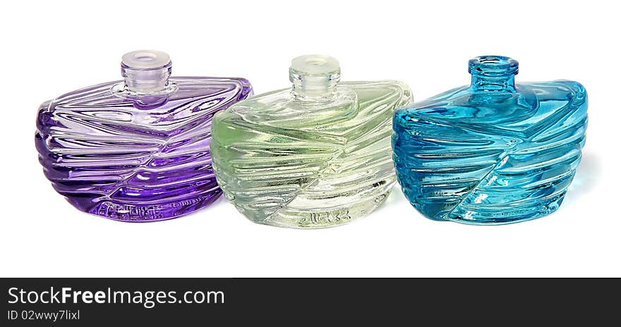 Three bottles of perfume isolated on a white background