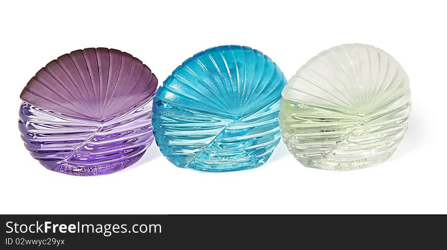 Three bottles of perfume on a white background.