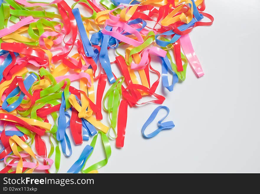 Colorful rubber bands on white background