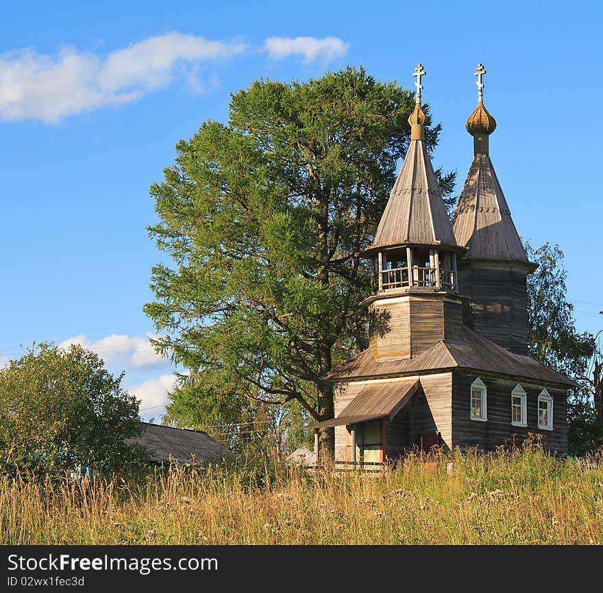 Old wooden chapel in north Russia, summer season