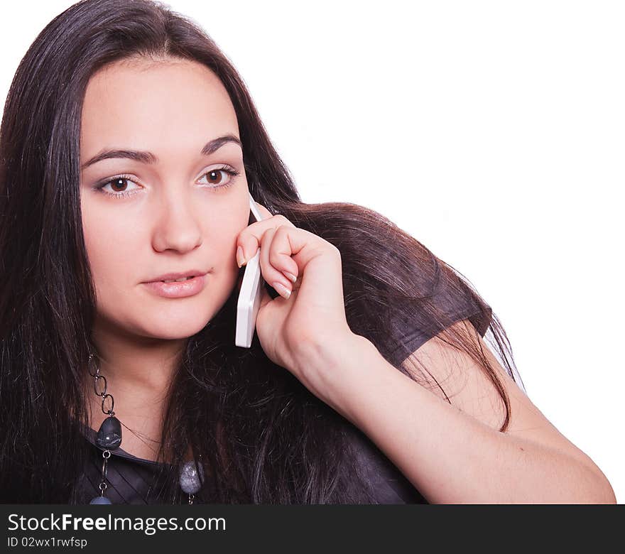 Charming young woman speaking by phone