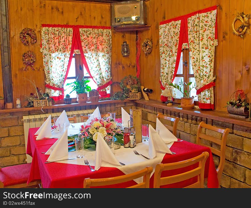 Nice restaurant table set with arranged silverware, plates and napkins. Nice restaurant table set with arranged silverware, plates and napkins