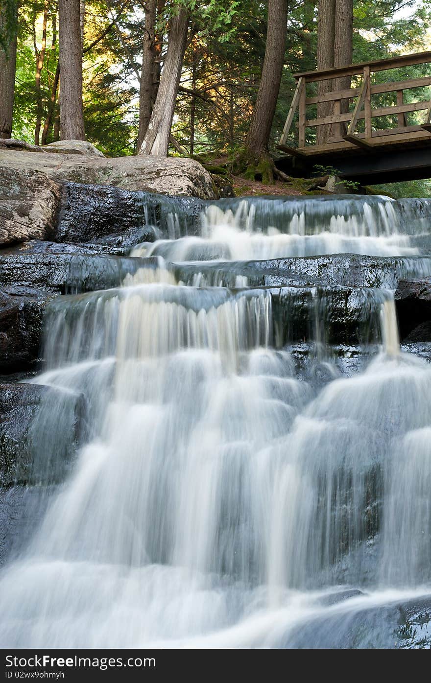 A small waterfall flows down the rocks in northern Ontario. A small waterfall flows down the rocks in northern Ontario.