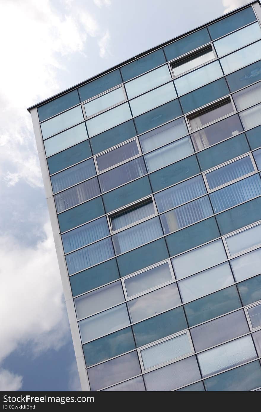 Modern trade office beside blue sky.