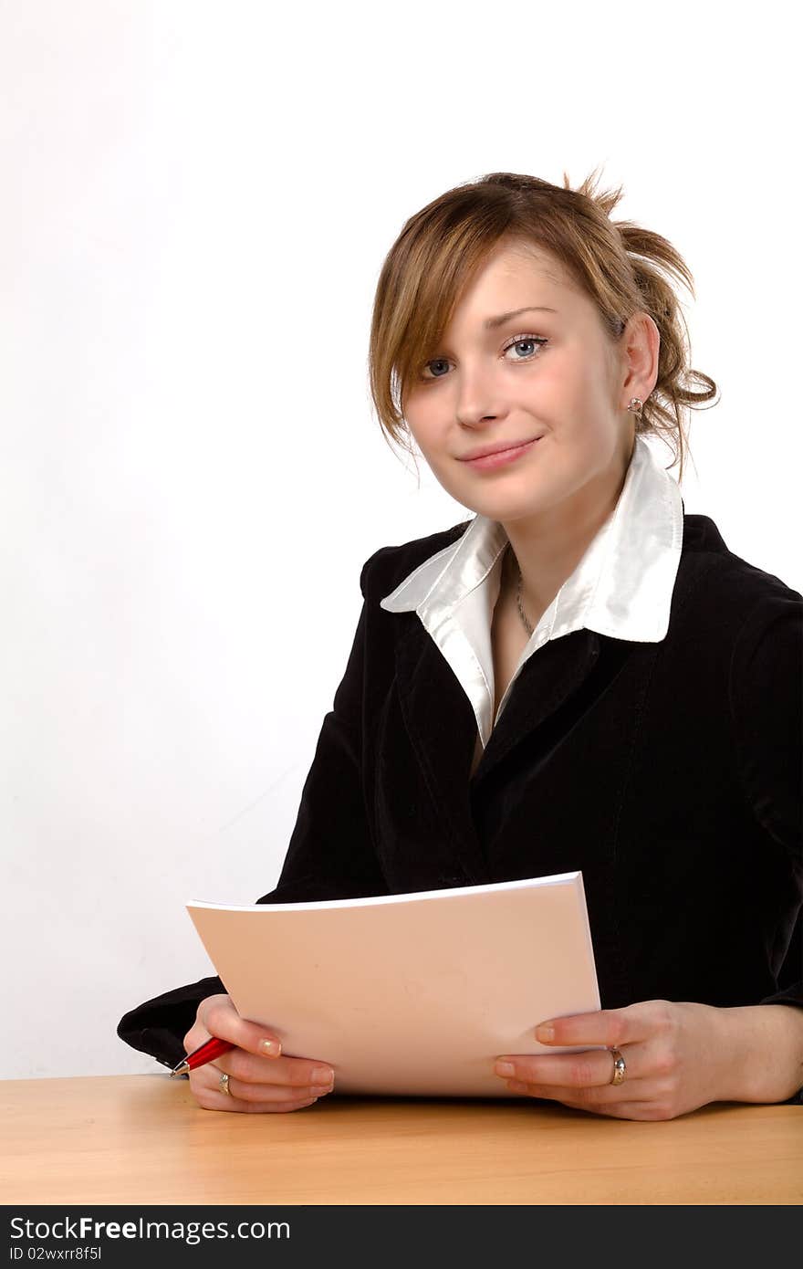 Businesswoman working at a desk, isolated on a white background