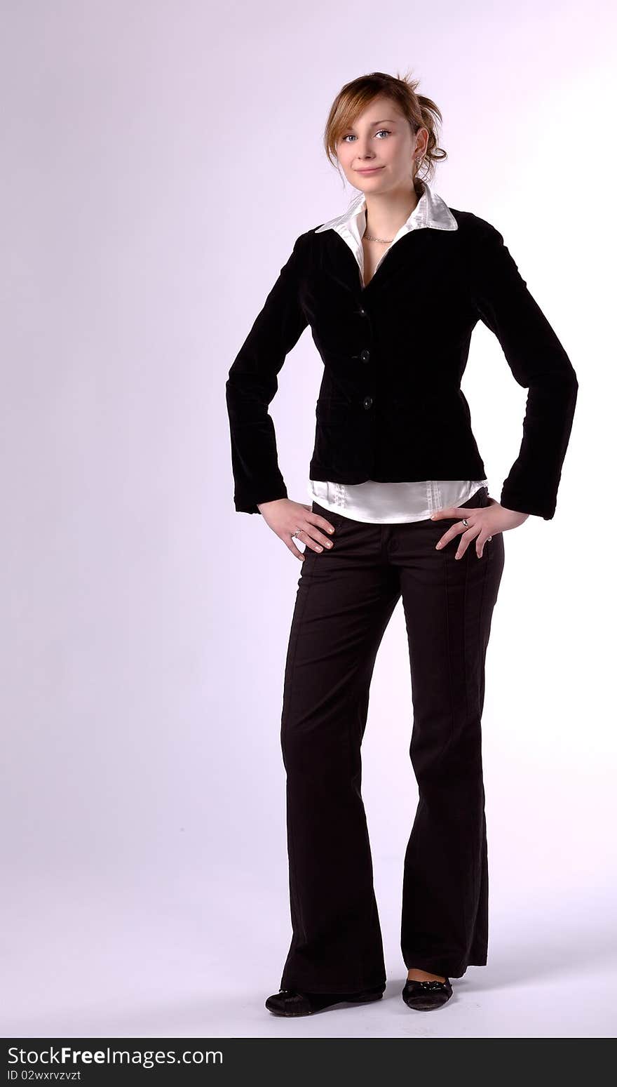 Standing young businesswoman, isolated on a white background. Standing young businesswoman, isolated on a white background