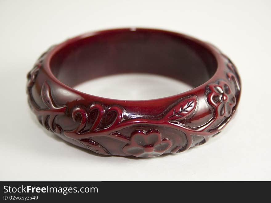 Antique style red bracelet on white background