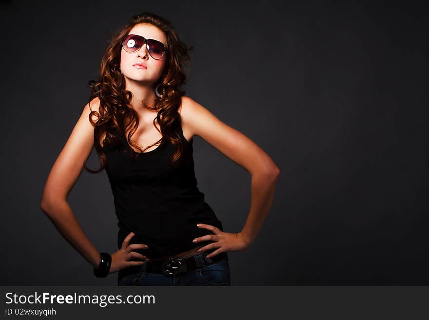 Picture of a young charming active girl on gray background