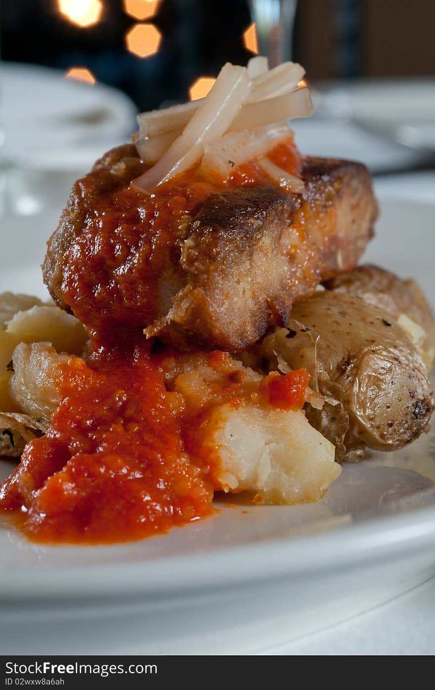 Grilled sweetbreads over potatoes