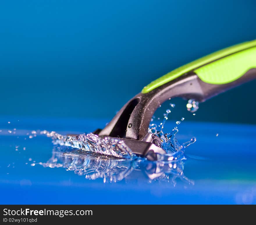 Razor  being cleaned with water